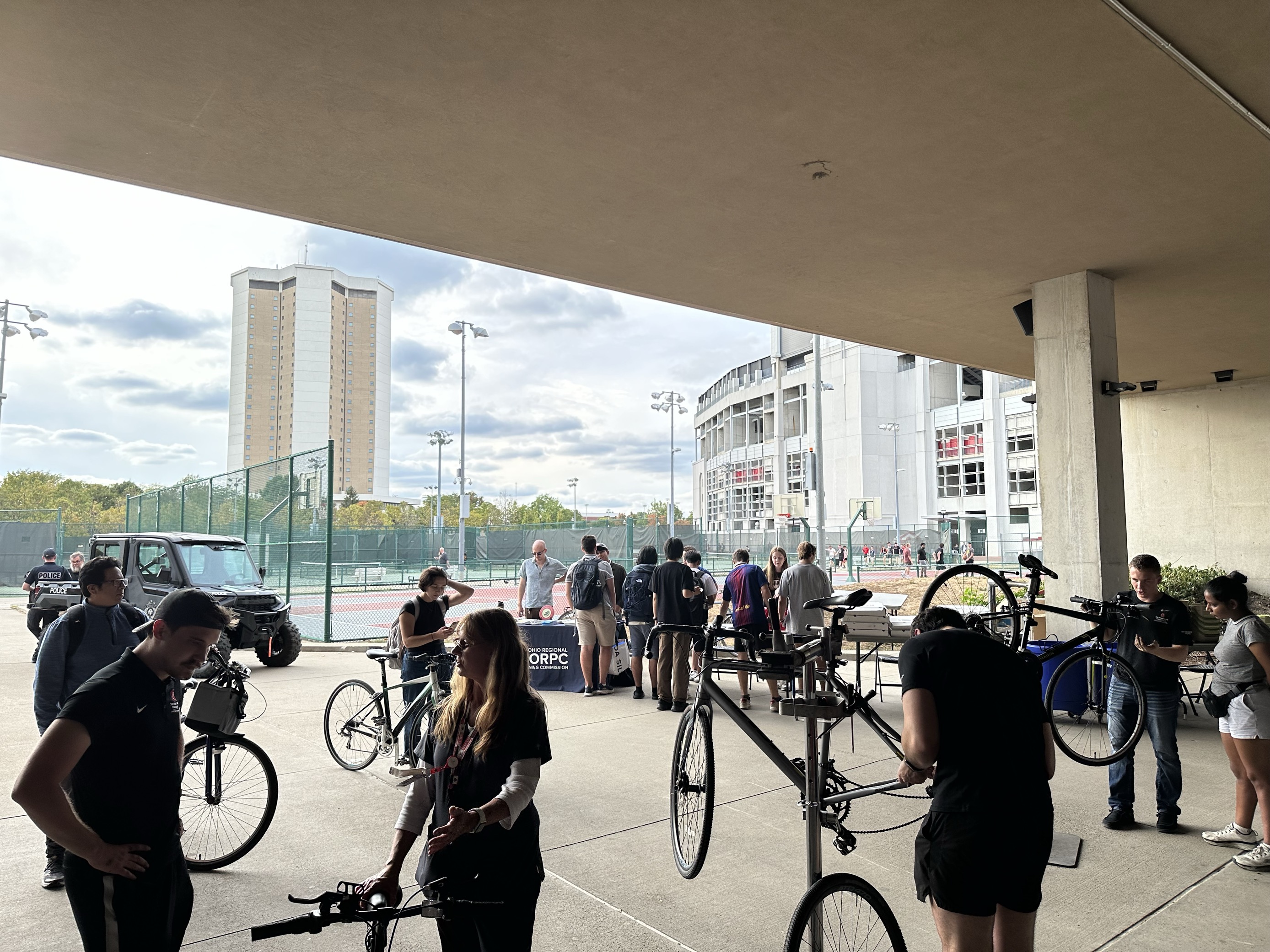 A view of people getting their bicycles tuned-up and waiting in line.