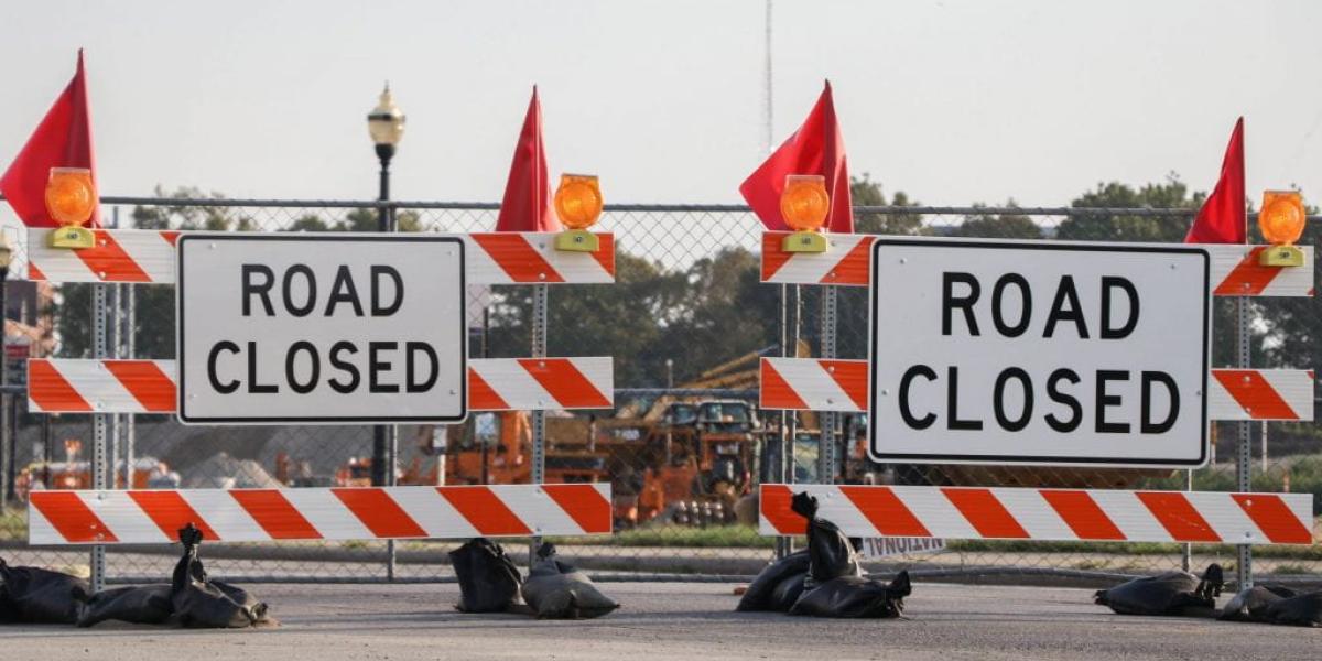 barriers with signage saying road closed