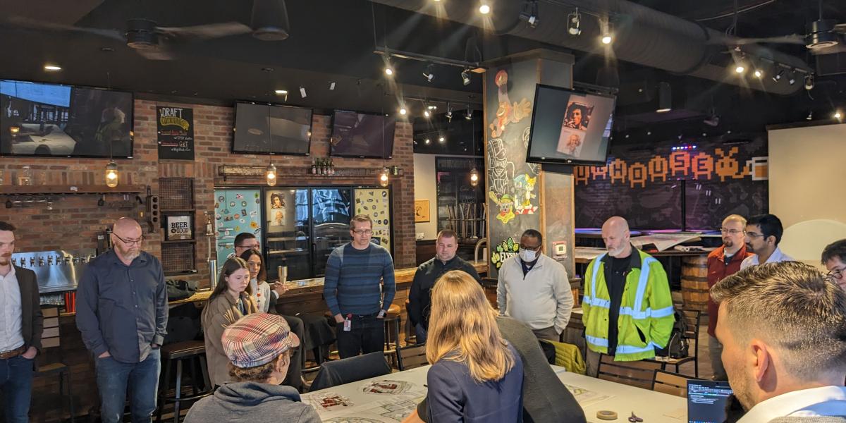 people standing around table