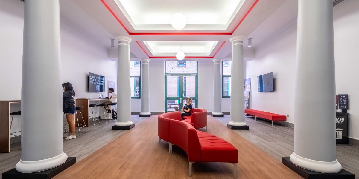 lobby with large pillars and soft, flexible seating