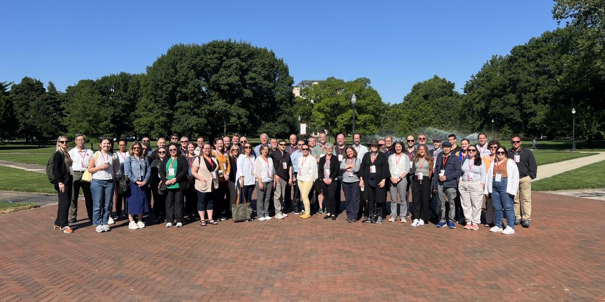 group of people standing on Oval