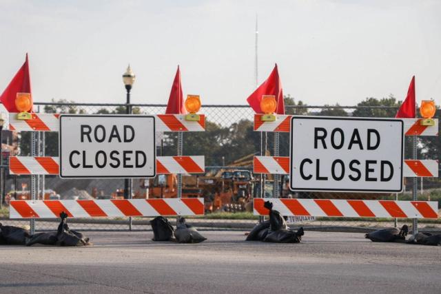 barriers with signage saying road closed