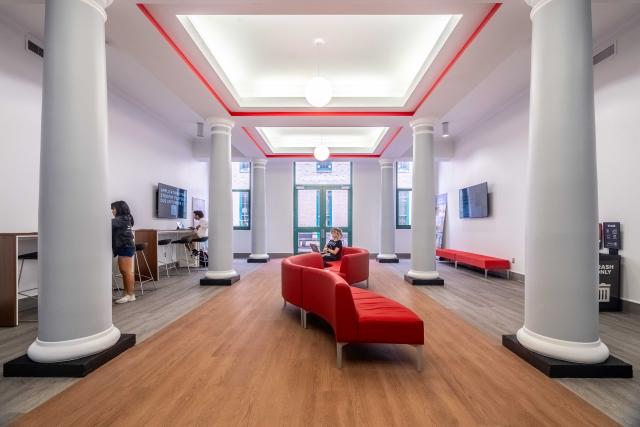 lobby with large pillars and soft, flexible seating