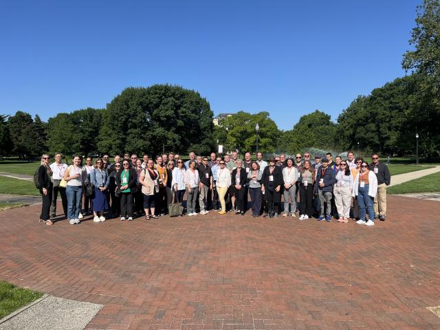 group of people standing on Oval